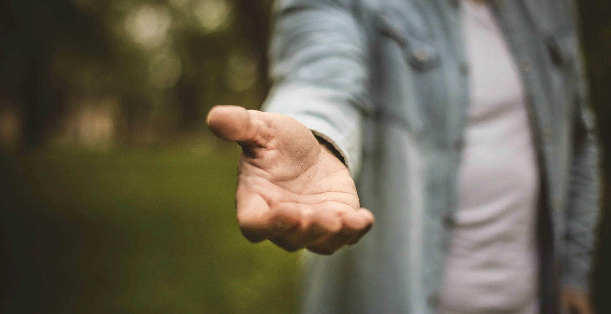 Person with hand out stretched to help