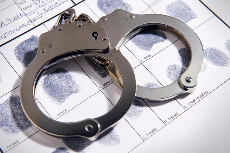 Handcuffs over rap sheet