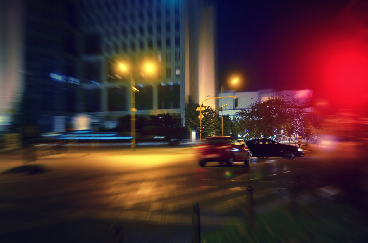Car speeding towards other car at night