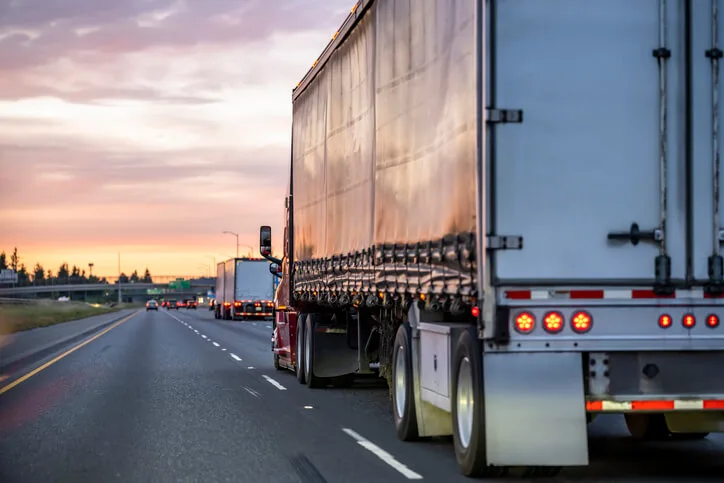 Truck driving in sunset