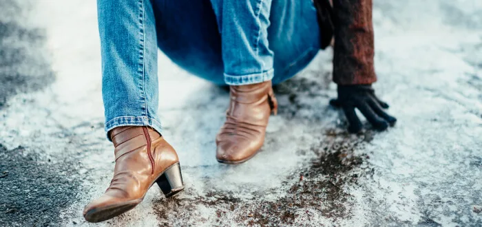 Woman slips and falls on icy sidewalk during the holidays