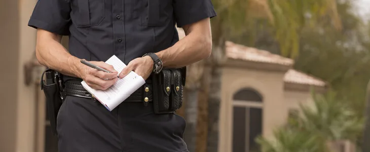Police officer writing down a report